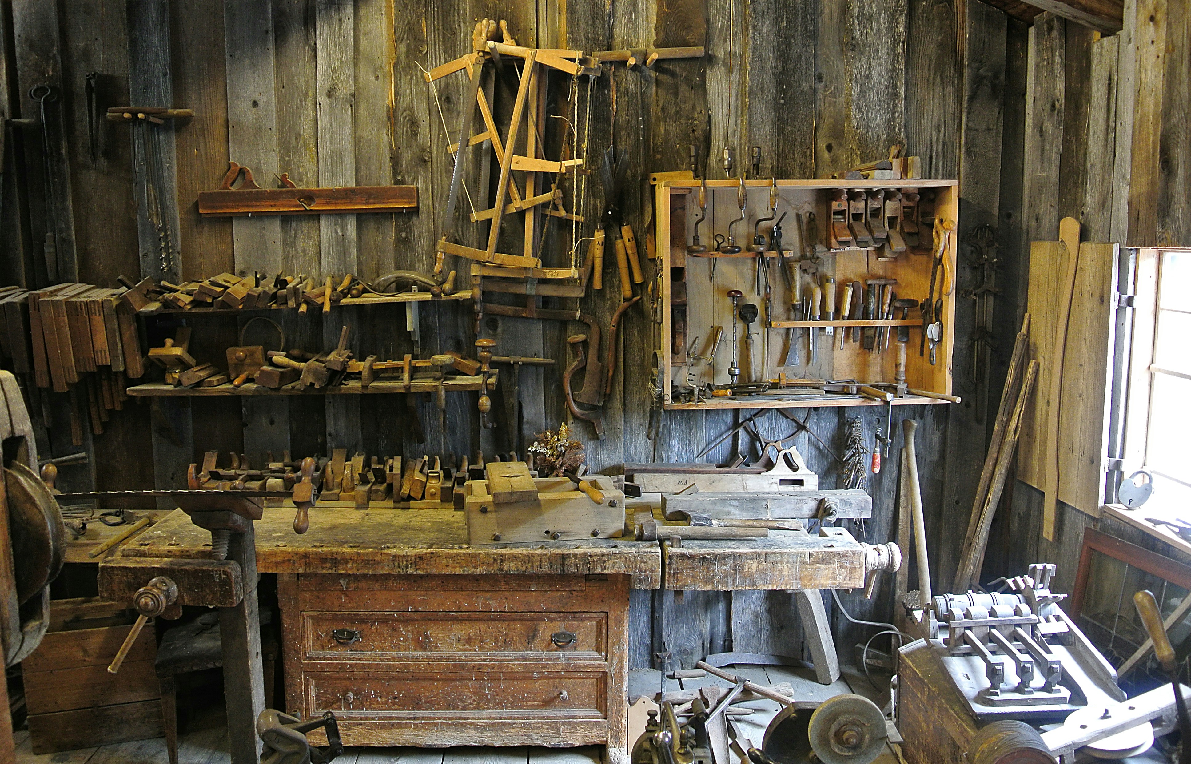 Woodworking workshop with hand tools on a workbench